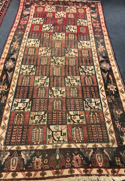 A Baktian multi coloured rug 290 x 50cm